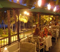 Lanai dining at dk Steakhouse is perfect for beautiful sunsets overlooking Waikiki Beach in Honolulu.