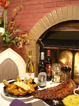 Enjoy Spanish Paella, BBQ Ribs and much more as you dine by one of the warm, cozy fireplaces at Las Brisas Restaurant.